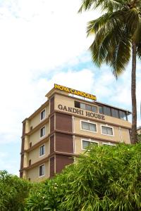 a building with a sign on top of it at Nova Candolim By Sudhanand, Candolim in Candolim