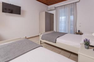 Posteľ alebo postele v izbe v ubytovaní Mike's Apartments