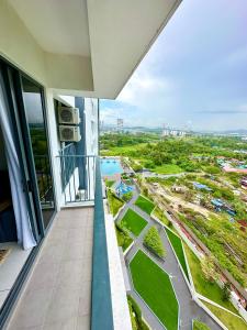 a balcony of a building with a view of a city at Holiday Inn Stay 3B2R Meritus Residensi Perai in Perai