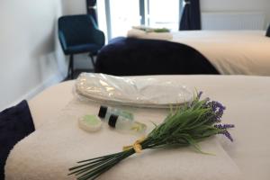 a table with a plastic bag and flowers on it at Sandbach Apartments in Sandbach