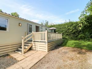 a home with a deck and a house at 22 Washbrook Way - Ashbourne Heights in Ashbourne