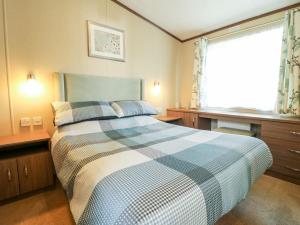 Säng eller sängar i ett rum på 22 Washbrook Way - Ashbourne Heights
