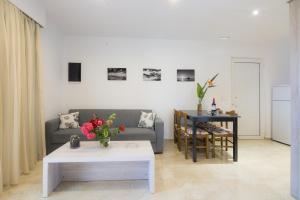 a living room with a couch and a table at Villa Giorgos in Kefalos