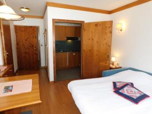 Posteľ alebo postele v izbe v ubytovaní Ski Residence