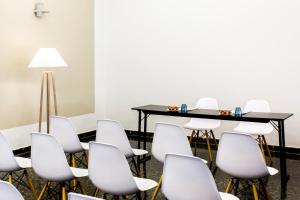 a conference room with a table and chairs at Hotel Pax Guadalajara in Guadalajara +60 photos