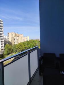 a balcony with a view of a city at Apartamenty METRO TARGÓWEK 27 in Warsaw