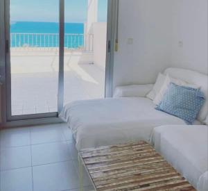 Posteľ alebo postele v izbe v ubytovaní Apartamento Primera Línea de playa