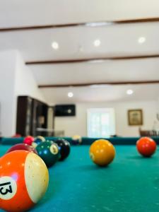 a pool table with billiard balls on top of it at Change The World - Solar de Alvega in Alvega