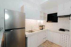 Kuchyň nebo kuchyňský kout v ubytování A’s Penthouse - Calbayog