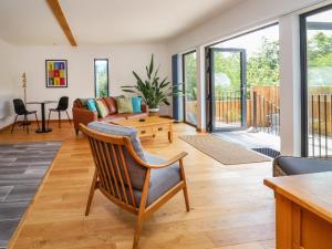 a living room with a couch and a table at No1 The Lodge in Bishops Castle