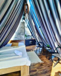 a room with two beds in a tent at Glamping A frame lake in Barajevo