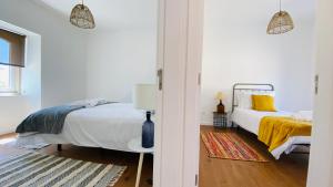 Postel nebo postele na pokoji v ubytování OceanLand - Santa Cruz
