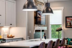 a kitchen with two pendant lights and a sink at Beaus Oasis - 3 Miles To Dtwn Nashville in Nashville
