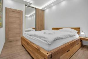 Postel nebo postele na pokoji v ubytování SKI Apartmán Snowcat