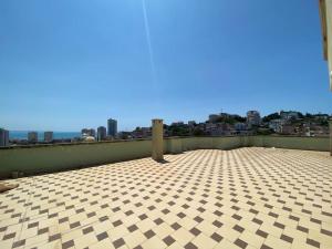 a roof top with a view of a city at StartApart City Center in Durrës