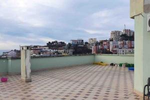 a balcony with a view of a city at StartApart City Center in Durrës
