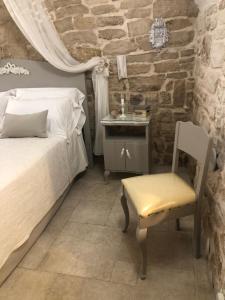 Ένα ή περισσότερα κρεβάτια σε δωμάτιο στο Le Maioliche