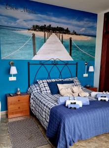 a bedroom with a blue bed and a pier at RINCON DO MAR Entre Mares in A Guarda +66 photos