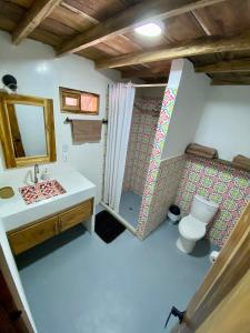 a bathroom with a sink and a toilet at Cabaña CasaMar Angelica in El Puertón