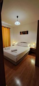 a bedroom with a bed with two towels on it at Dama Apartment in Senj