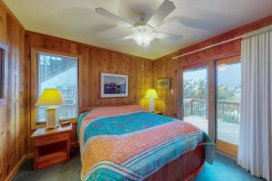 a bedroom with a bed and a balcony at Fiddlesticks #4-2 in Avon