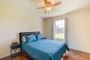 a bedroom with a bed and a ceiling fan at Houston Vacation Rental 14 Mi to Downtown in Houston