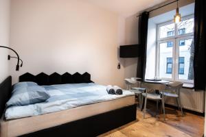 Łóżko lub łóżka w pokoju w obiekcie Dream Apartments - Gdańska 72