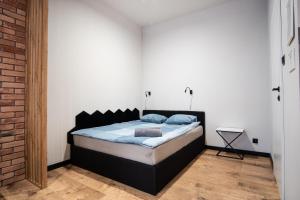 Łóżko lub łóżka w pokoju w obiekcie Dream Apartments - Gdańska 72