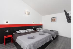 Łóżko lub łóżka w pokoju w obiekcie Villa LM