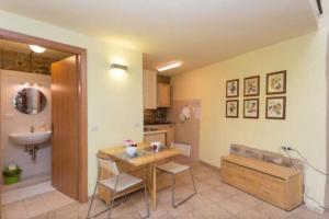 a kitchen with a table and a sink at Lovely apartment in the heart of Perugia in Perugia