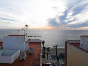 a view of the ocean from the balcony of a building at Apartamento a 1 MINUTO de la playa en GARRUCHA in Garrucha