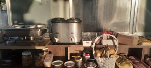 a kitchen with a counter top with a stove and a counter top at Vitória Center Plaza Praça in Nova Friburgo