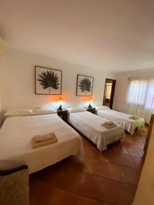 Posteľ alebo postele v izbe v ubytovaní Roc Beach Villa