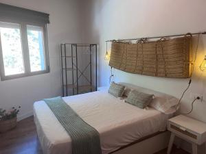 מיטה או מיטות בחדר ב-El Descanso