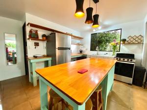 a large kitchen with a wooden table in it at Casa Johanna, Charm and Tranquillity ! in Atenas