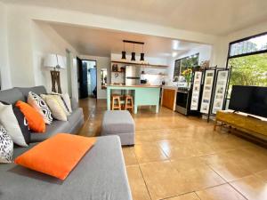 a living room with a couch and a kitchen at Casa Johanna, Charm and Tranquillity ! in Atenas