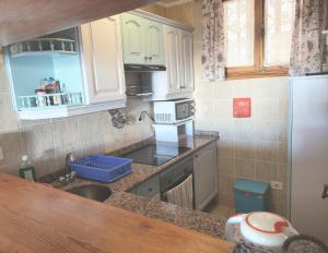 A kitchen or kitchenette at Bellas Vistas Parque Santiago 2