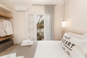 A bed or beds in a room at TRINITY THE HOTEL