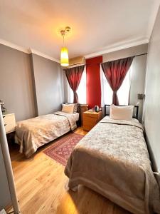 A bed or beds in a room at Ahmet Efendi Evi
