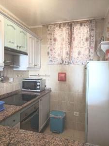 A kitchen or kitchenette at Bellas Vistas Parque Santiago 2