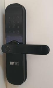 a black cell phone is attached to a wall at Apartamento Inteiro in Blumenau