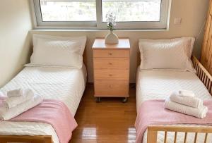 Postel nebo postele na pokoji v ubytování Sweet Makri Suite
