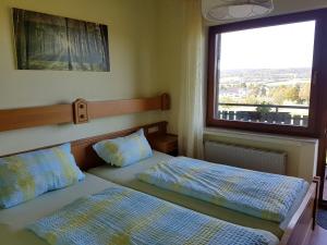 Ένα ή περισσότερα κρεβάτια σε δωμάτιο στο Hotel Wildenburger Hof