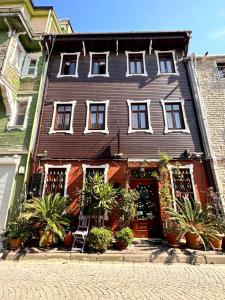 a large house with plants in front of it at Ahmet Efendi Evi in Istanbul