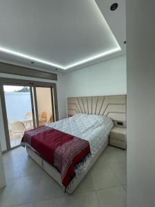 a bedroom with a bed and a view of the ocean at Good Life Top House Btw Sea & Montain 