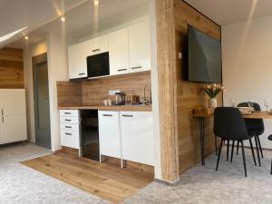 Kuchyň nebo kuchyňský kout v ubytování Apartmán u Ovečků - Nová Paka