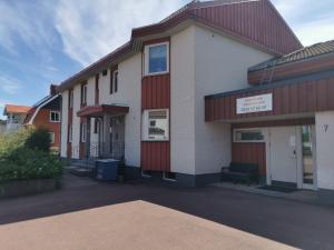 a building with a red and white at Saxvikens vandrarhem in Mora