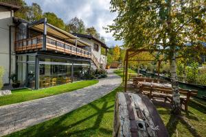 a house with a bench in front of it at Vecchio Mulino StarsBox in Entracque