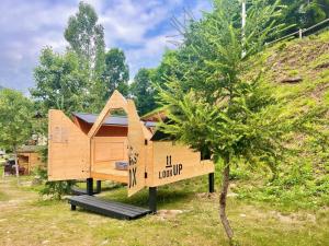 a tree house in the middle of a yard at Vecchio Mulino StarsBox in Entracque