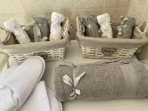 a group of towels and baskets on a counter at Penthouse360view in Karistos